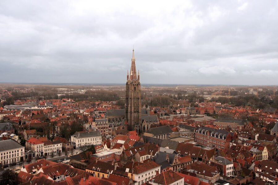 From Amsterdam: Bruges Day Trip in English with Boat Option - Pickup in Amsterdam and the coach ride routine