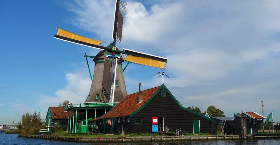 From Amsterdam: Windmills, Volendam, & Marken Private Tour - The Marken ferry ride and the houses on wooden poles