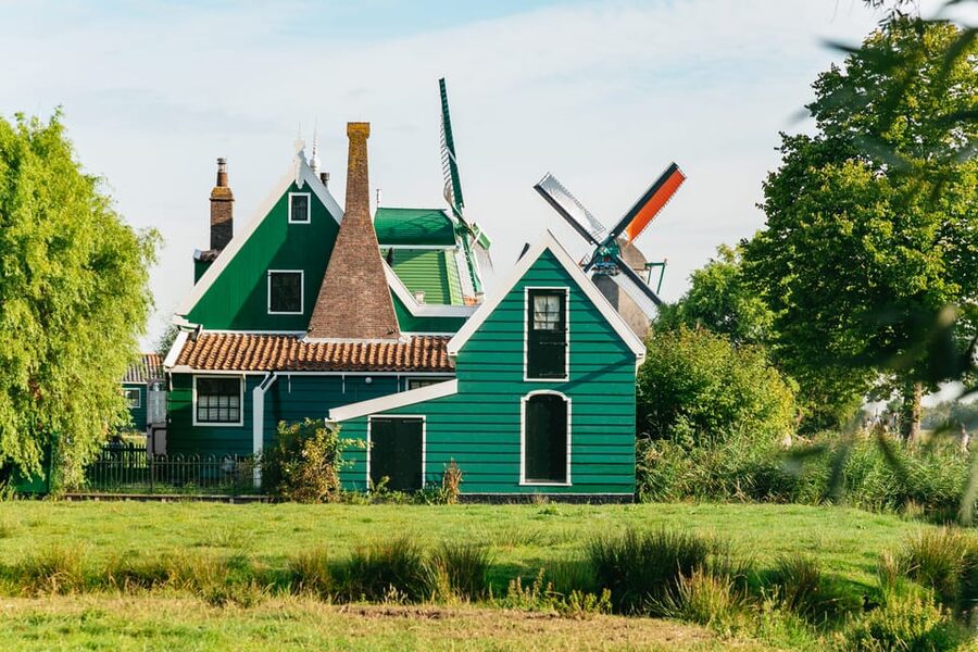 From Amsterdam: Zaanse Schans, Edam, Volendam & Marken - Marken island village: wooden houses, harbor calm, and a church stop