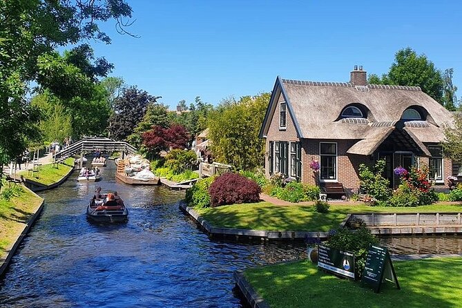 Giethoorn Day Tour from Amsterdam with Small Boat Ride - Walking tour of canal homes, bridges, and the thatched roofs