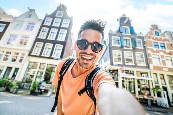 Historic Amsterdam Walking Tour: Royal Palace & Flea Markets - Entering Amsterdam’s center with a tight, guided route