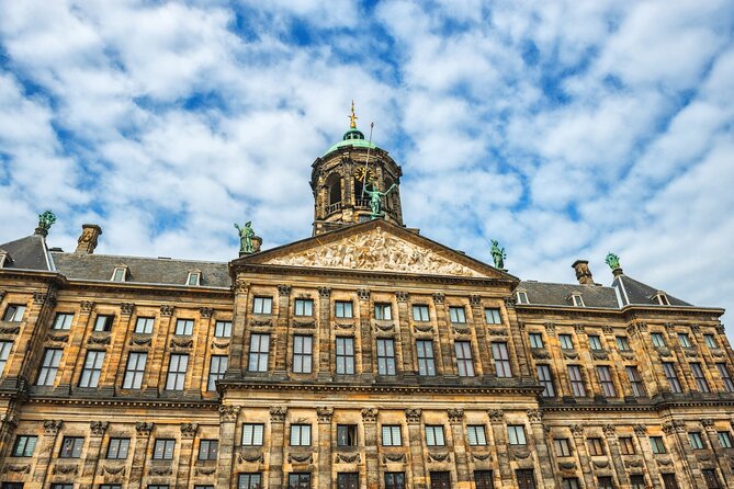Historic Amsterdam Walking Tour: Royal Palace & Flea Markets - Royal Palace Amsterdam and Dam Square: postcard sights with context