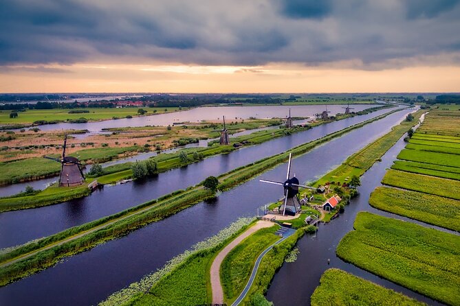Kinderdijk Windmills and Delft Small-Group Tour from Amsterdam - Getting to Kinderdijk, the Polder World Heritage Site