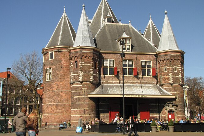 Old Amsterdam: A Self-Guided Audio Tour - Market energy at Waterlooplein, plus the bridge-and-canal rhythm