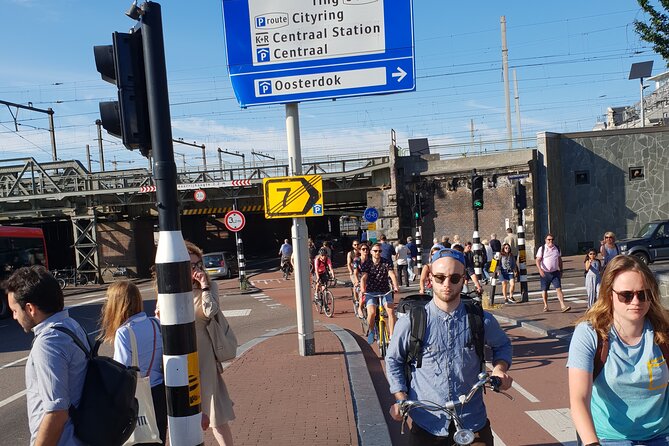 Private Minivan Sightseeing Tour in Amsterdam - Canal-side neighborhoods and shopping streets that show a different Amsterdam