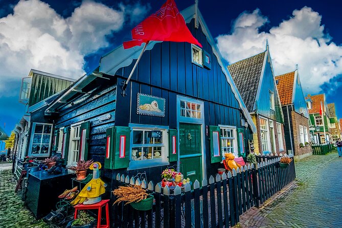 Private Tours to Zaanse Schans, windmill house, Volendam, Marken - Volendam harbor time: food, costumes, and an Ijsselmeer boat ride