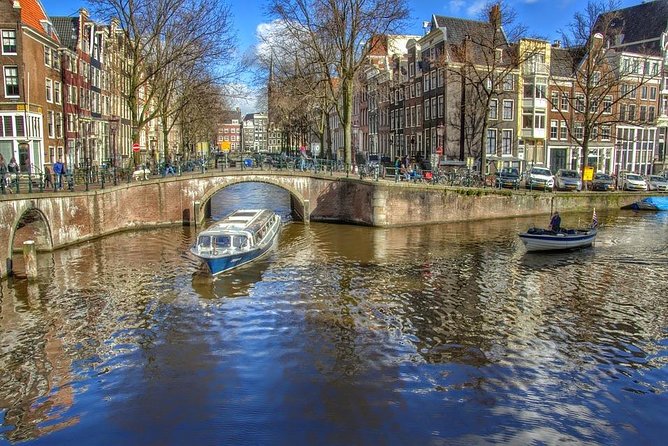Red Light District tour with canal cruise - Old Town context: The Dam, wooden poles, and Amsterdam’s foundation