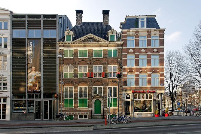 Rembrandt House & Neighborhood Exclusive Guided Walking Tour - Amstel River bridges and the Stopera: where the city keeps layering