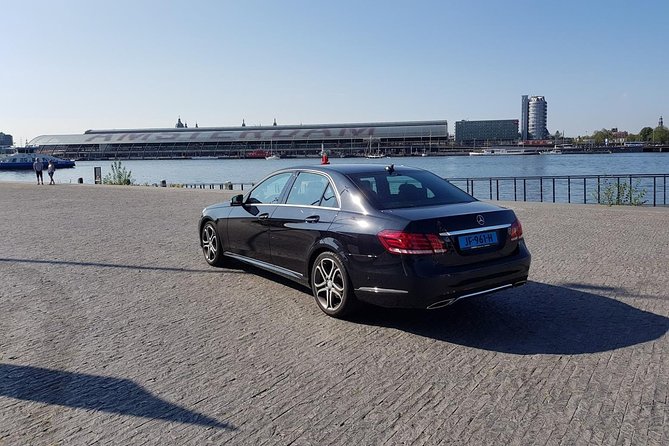 Schiphol Airport Private Transfer to Amsterdam with Meet & Greet - Onboard Comfort: Bottled Water and Wi-Fi for the First Hour