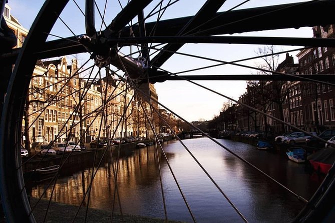 Urban Adventures Amsterdam Bike Tour, Graffiti and Magnet Fishing - Price, group size, and value at about $59.26